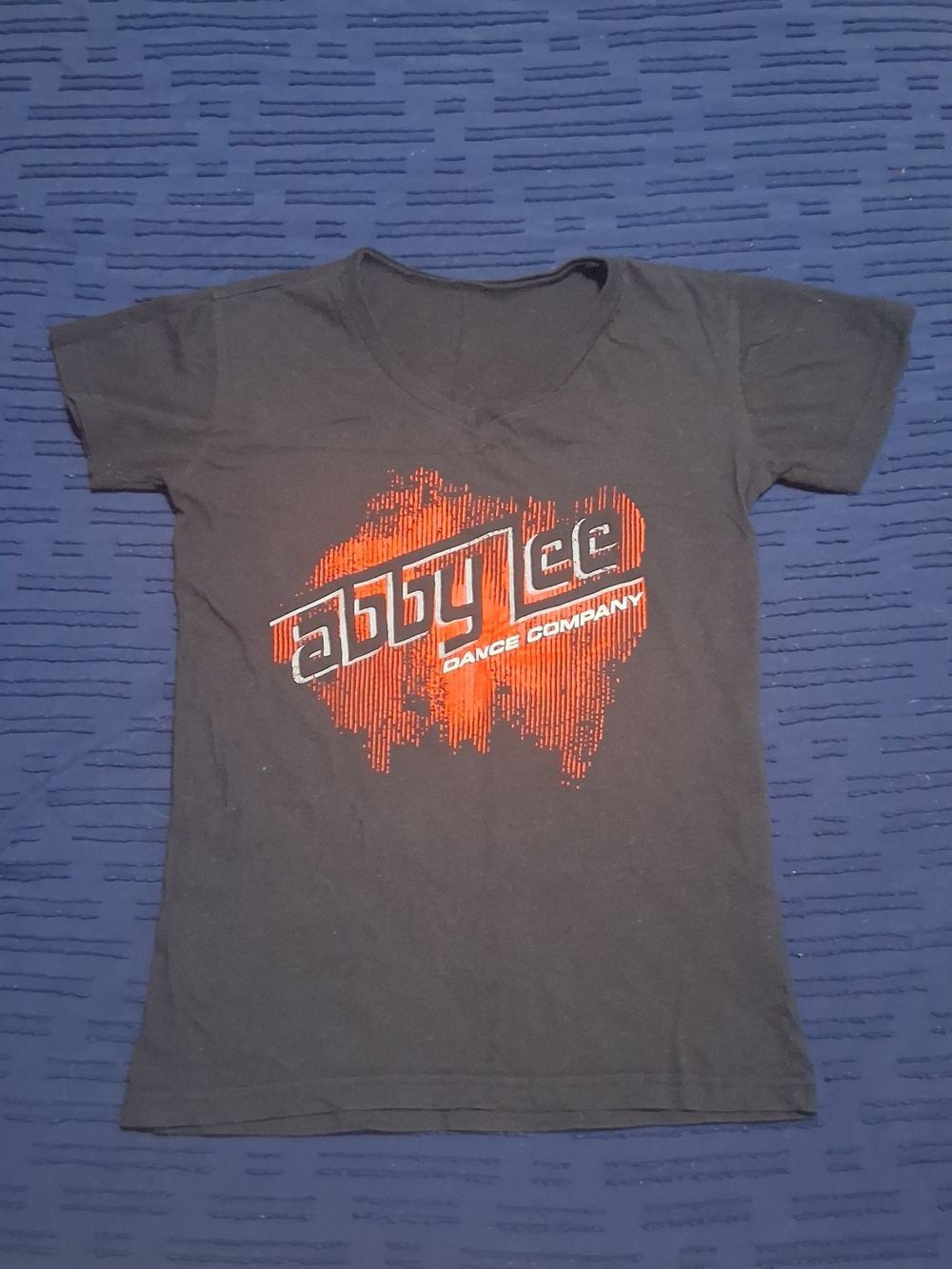 Abby Lee Dance Company Ladies Black V-Neck Tee with Red Logo Sz S